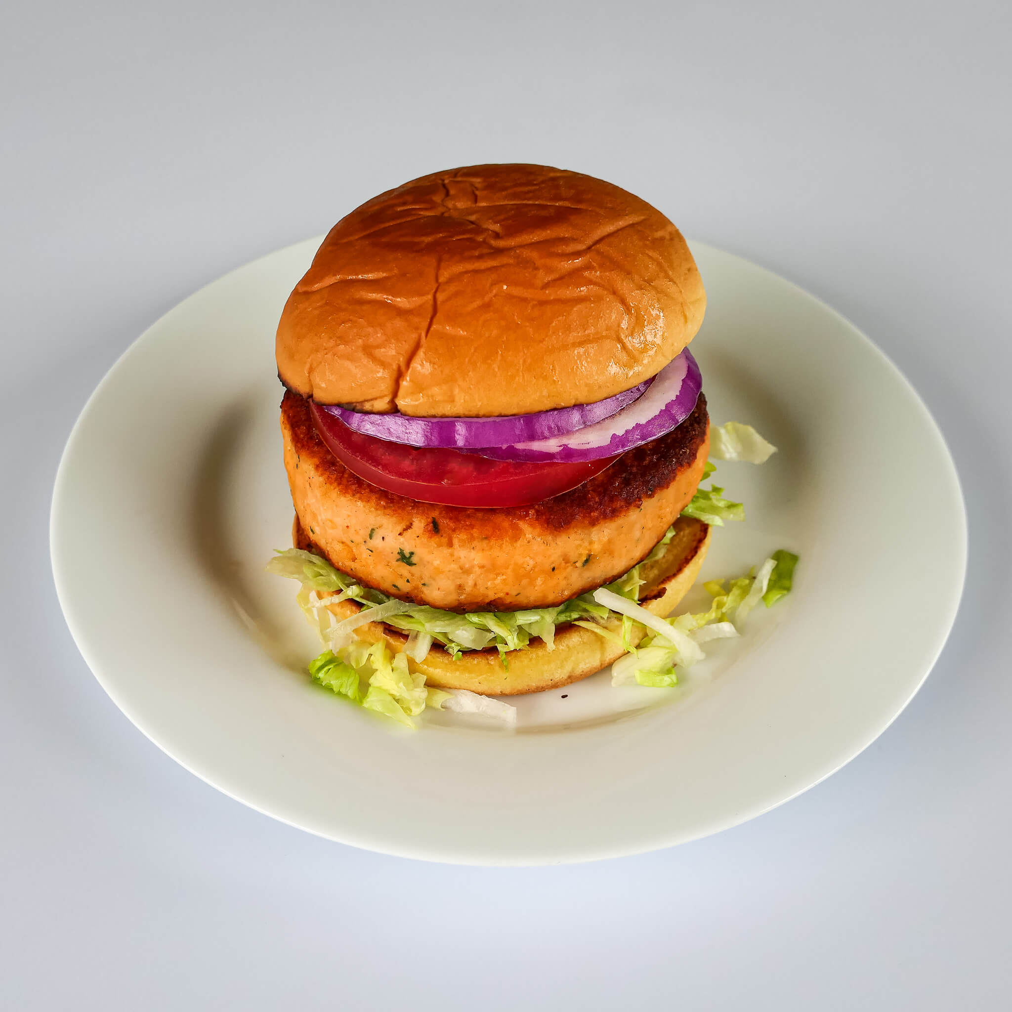 http://www.northcoastseafoods.com/cdn/shop/products/SalmonBurger_plated.jpg?v=1655747580