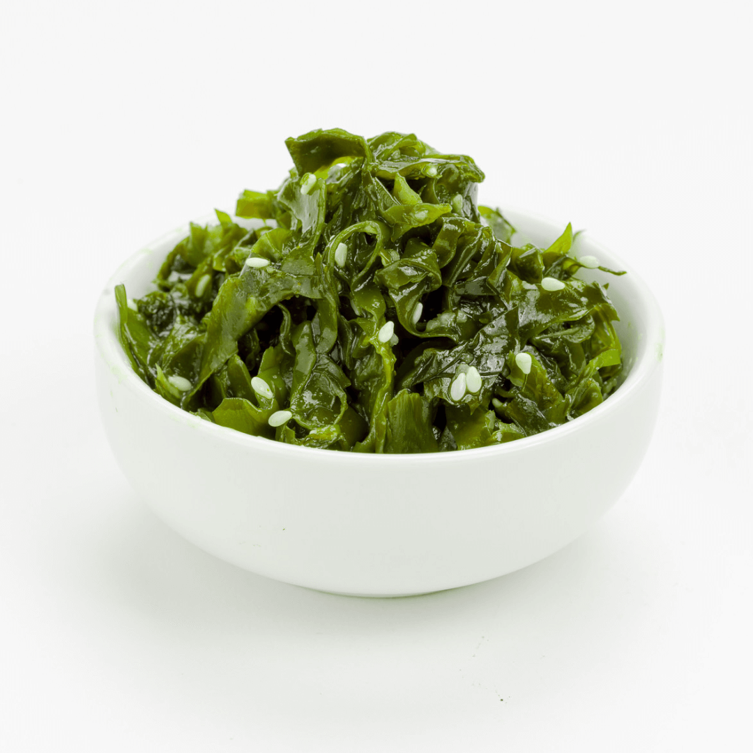 Contemporary white ceramic bowl filled with chilled fresh kelp salad