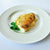 fresh haddock portion on a black background with a lemon wedge