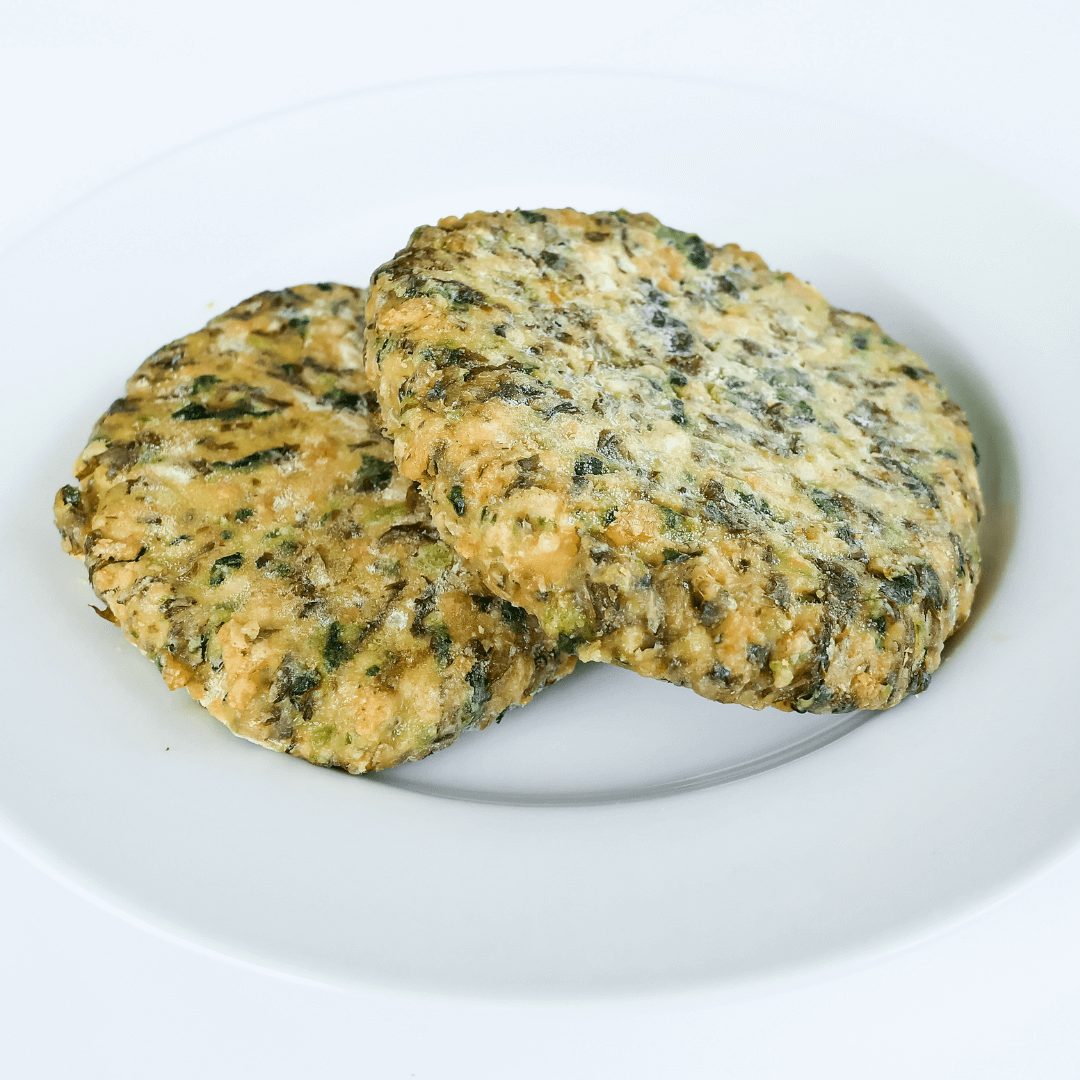 two 3.25-ounce raw kelp burgers on a white plate