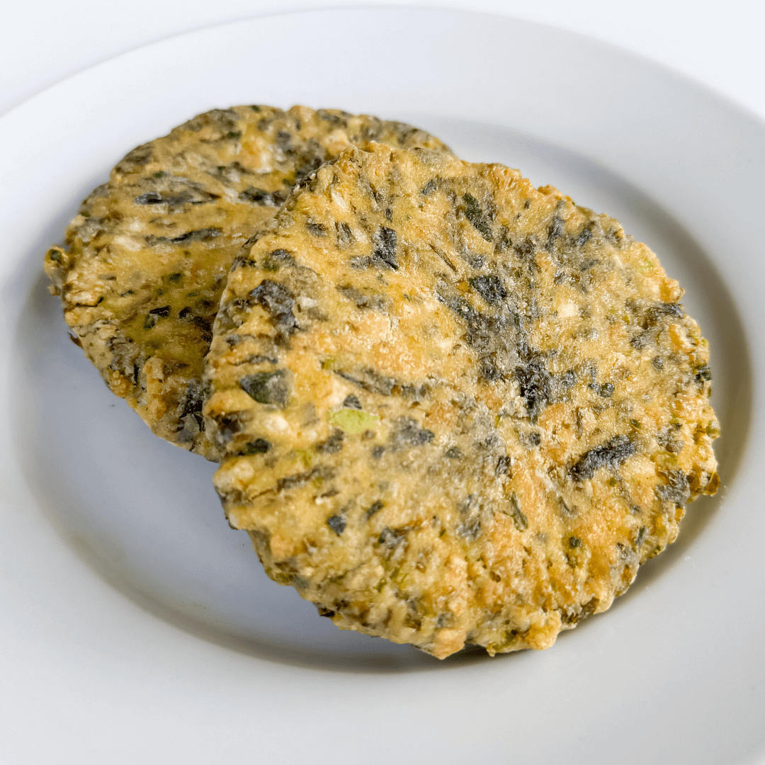 uncooked kelp burgers on a white plate