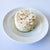 Culinary Reserve lump crab meat with top of can in a white bowl