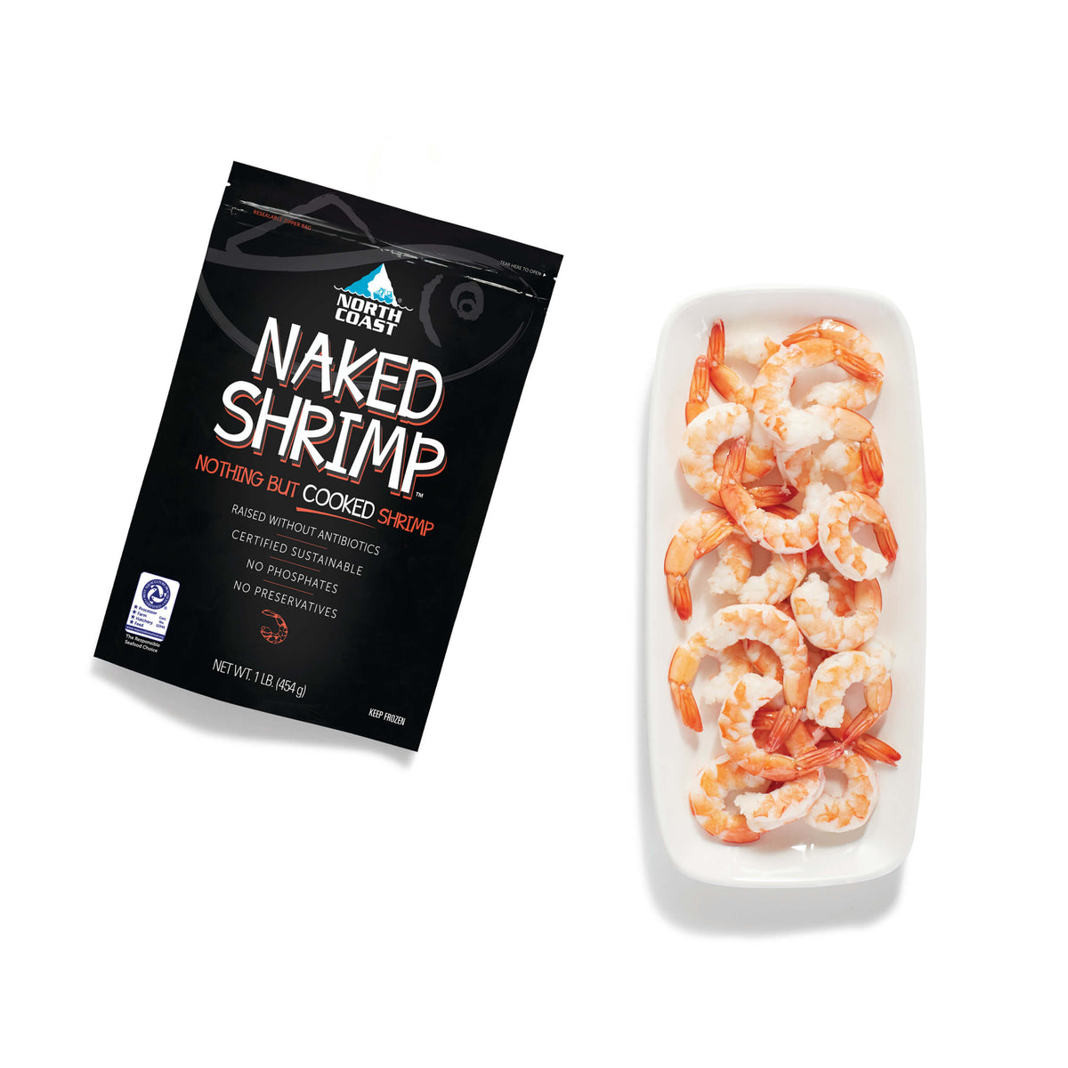 naked shrimp bag next to cooked shrimp on a white plate