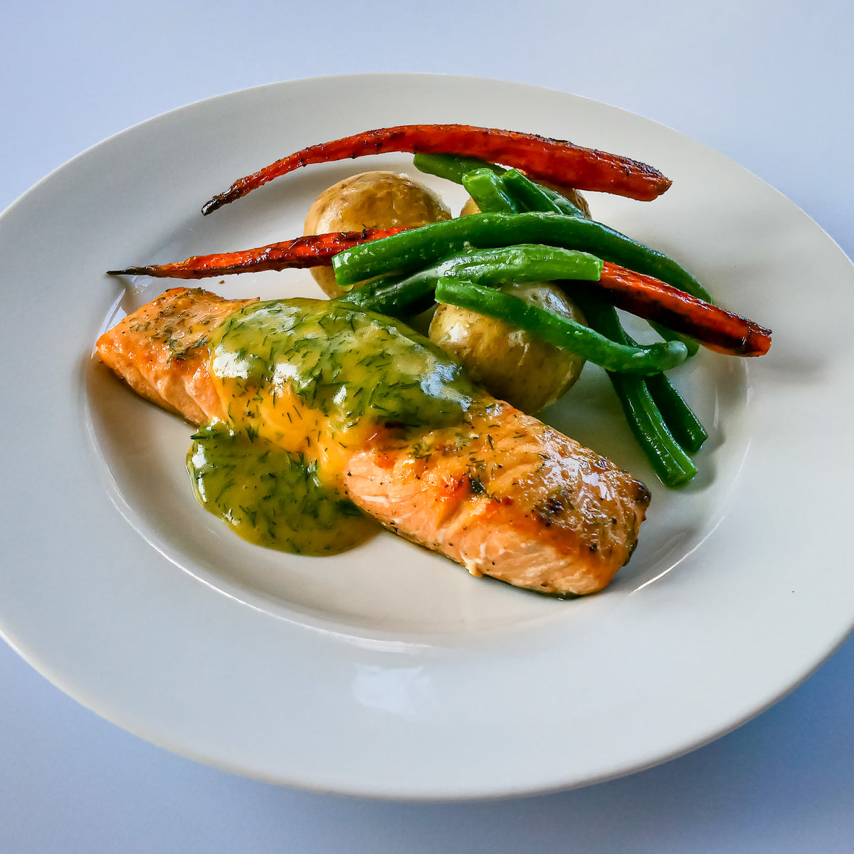 Cooked Organic Salmon with Veggies on a Dish