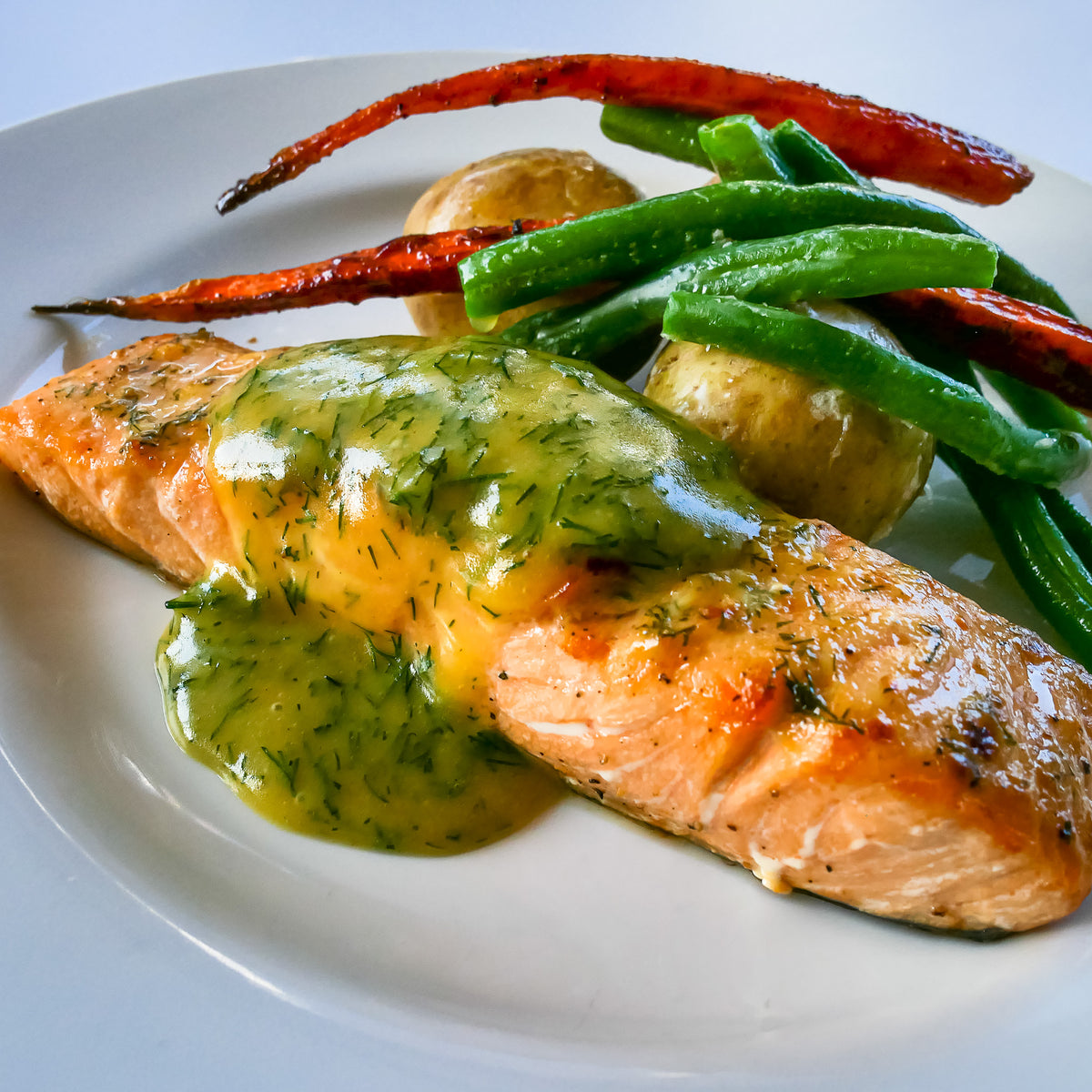 Cooked Organic Salmon with Veggies on a Dish