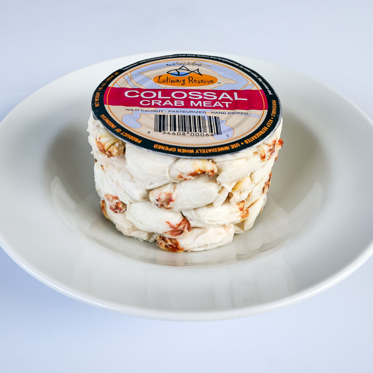Culinary Reserve colossal crab meat with top of can in a white bowl