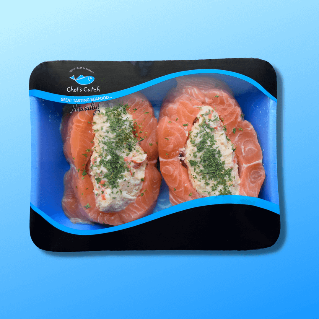 baked stuffed salmon on a white plate